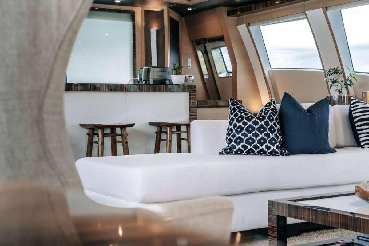 a white couch with pillows aboard VANTAGE Yacht for Sale
