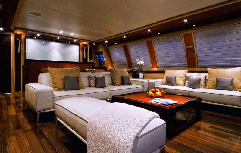 a living room with a couch and a table aboard VANTAGE Yacht for Sale