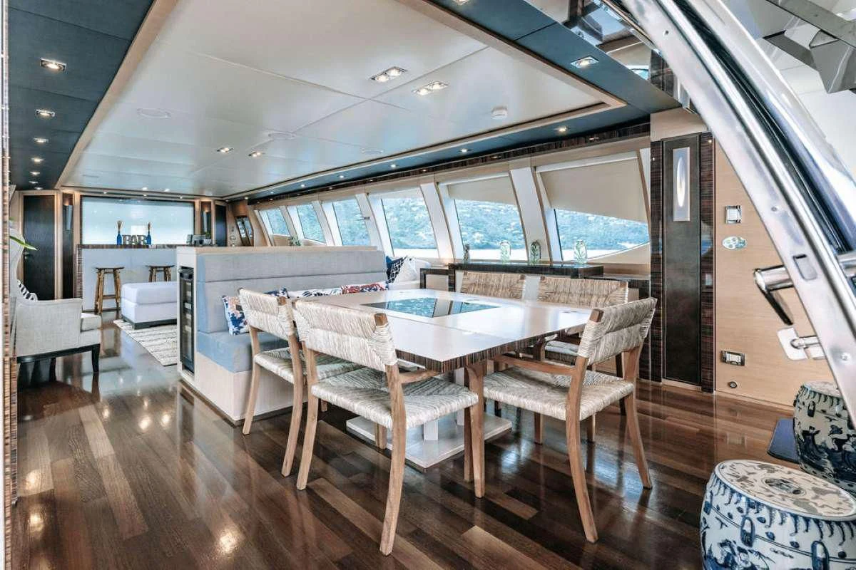 a room with a table and chairs aboard VANTAGE Yacht for Sale