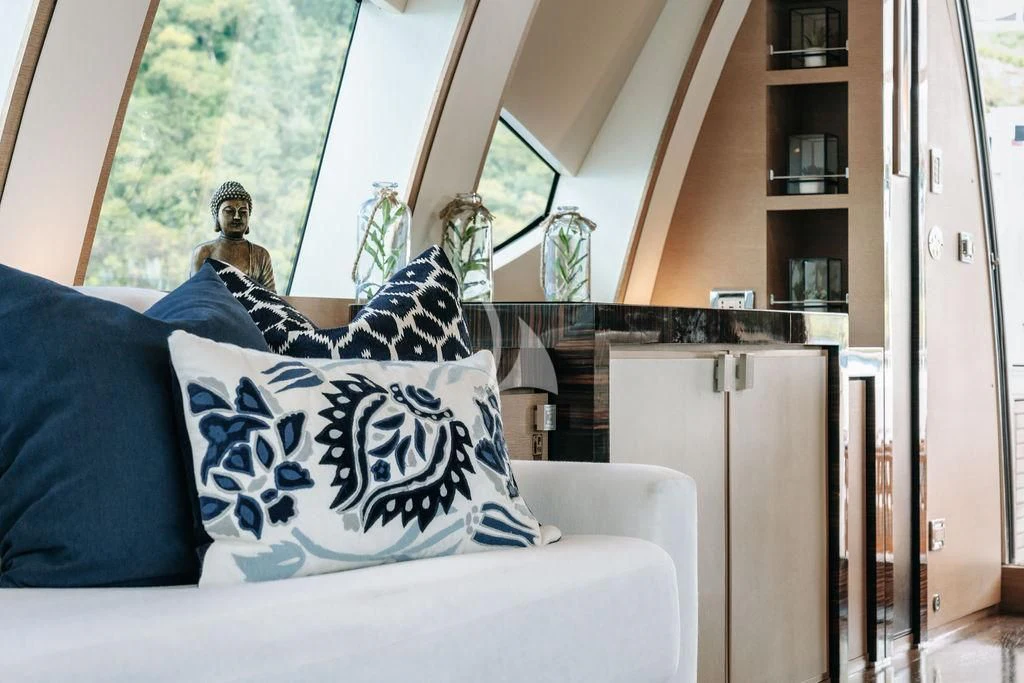 a person sitting on a couch aboard VANTAGE Yacht for Sale