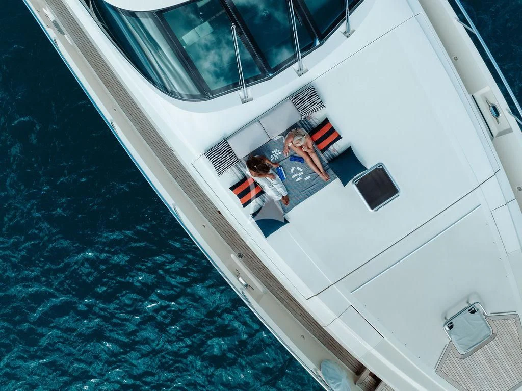a man and woman in a boat aboard VANTAGE Yacht for Sale