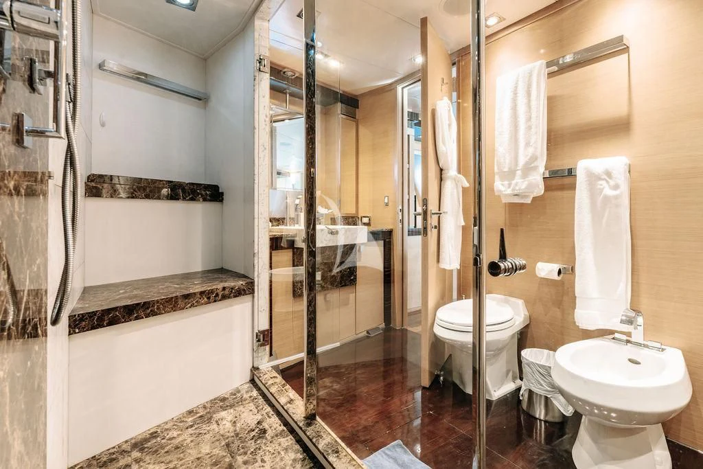 a bathroom with a glass shower aboard VANTAGE Yacht for Sale