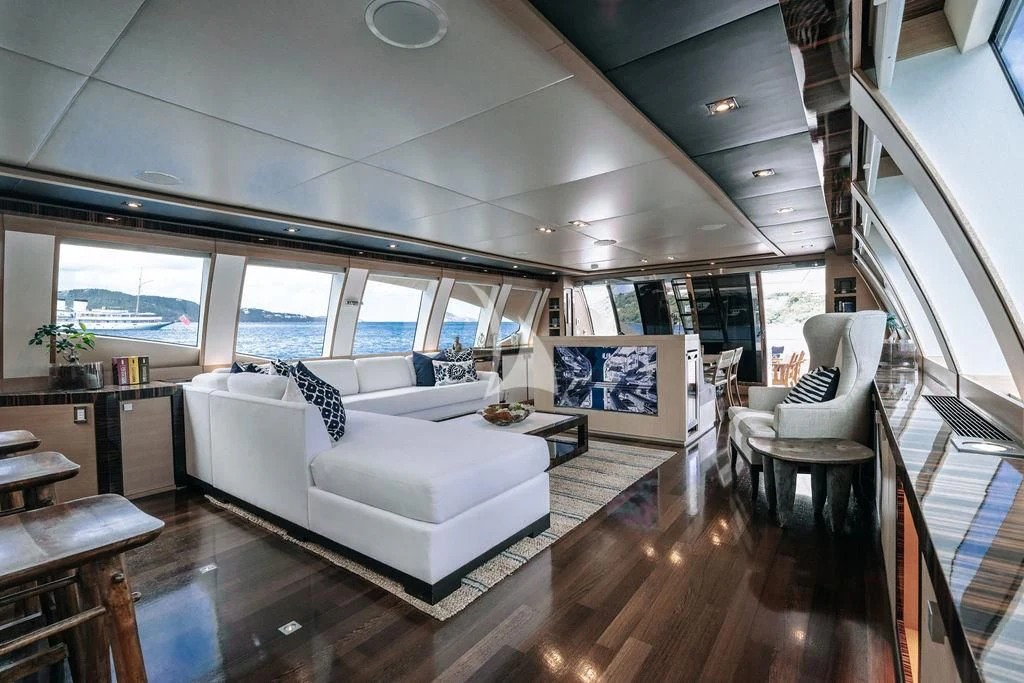 a living room with a large window aboard VANTAGE Yacht for Sale