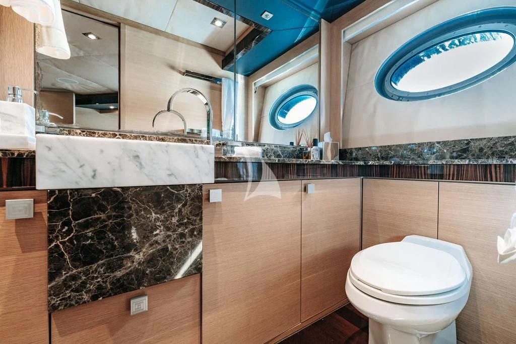a bathroom with a marble counter aboard VANTAGE Yacht for Sale