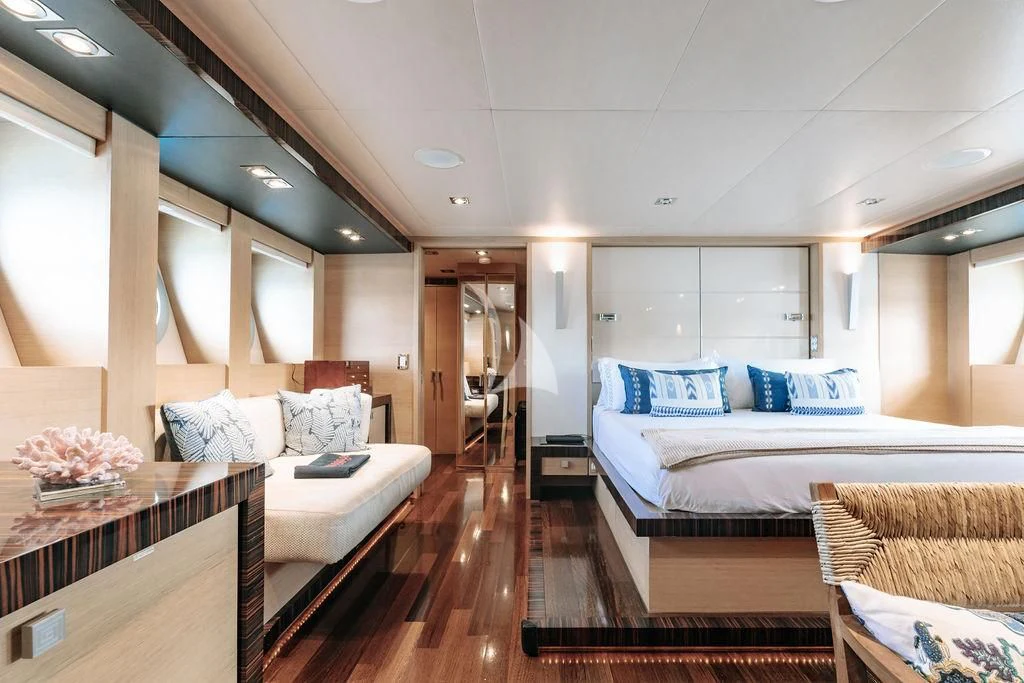 a room with a bed and a couch aboard VANTAGE Yacht for Sale