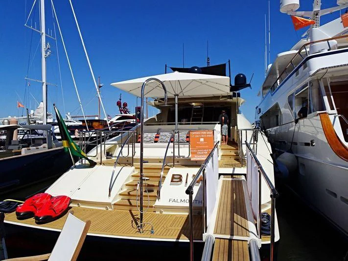 a boat docked at a pier aboard VANTAGE Yacht for Sale