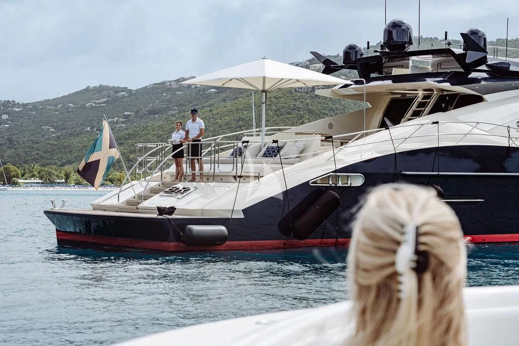 a boat with a flag on it aboard VANTAGE Yacht for Sale