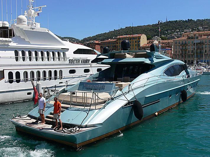 a couple of people standing on a boat in the water aboard VANTAGE Yacht for Sale