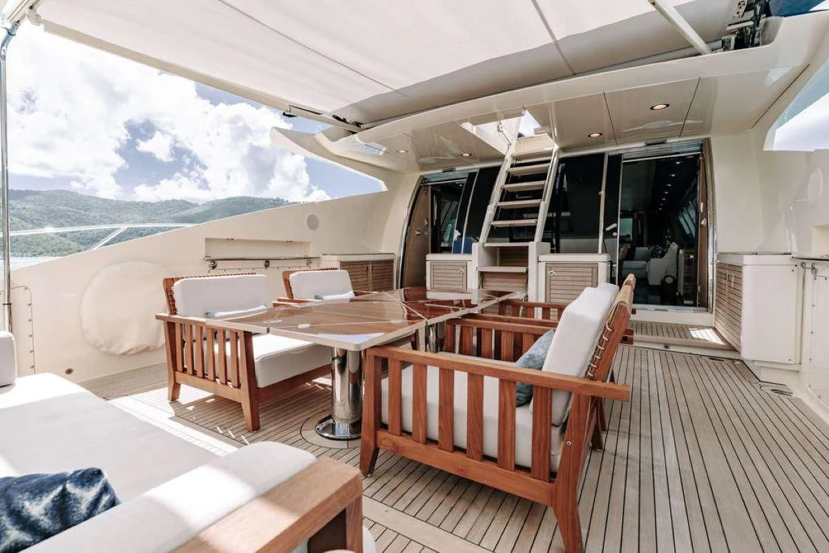 a room with a table and chairs aboard VANTAGE Yacht for Sale