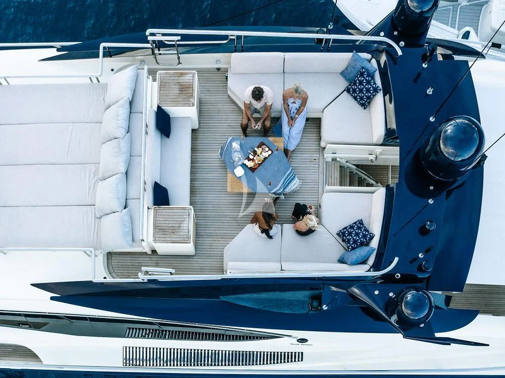 a boat with a blue canopy aboard VANTAGE Yacht for Sale