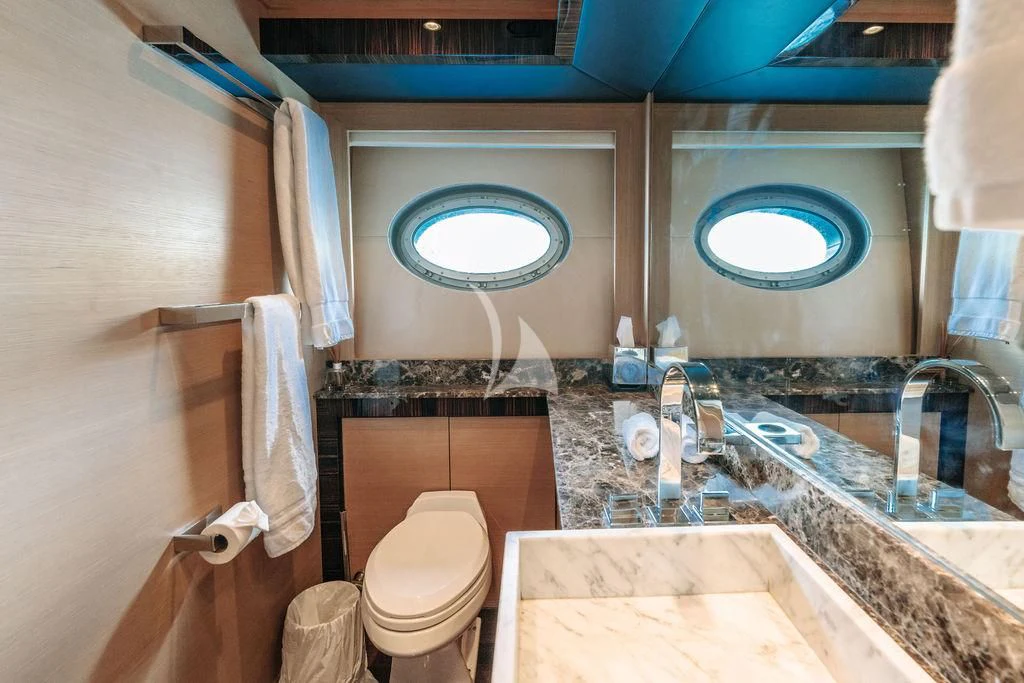 a bathroom with a marble countertop aboard VANTAGE Yacht for Sale