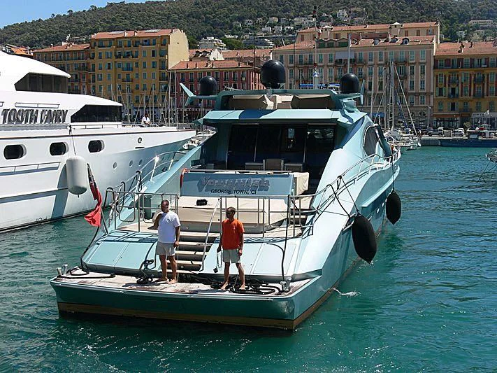 a couple of people standing on a boat in the water aboard VANTAGE Yacht for Sale