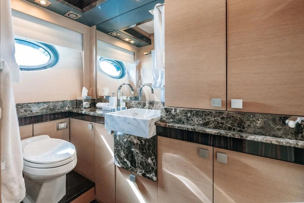 a bathroom with a marble counter top aboard VANTAGE Yacht for Sale