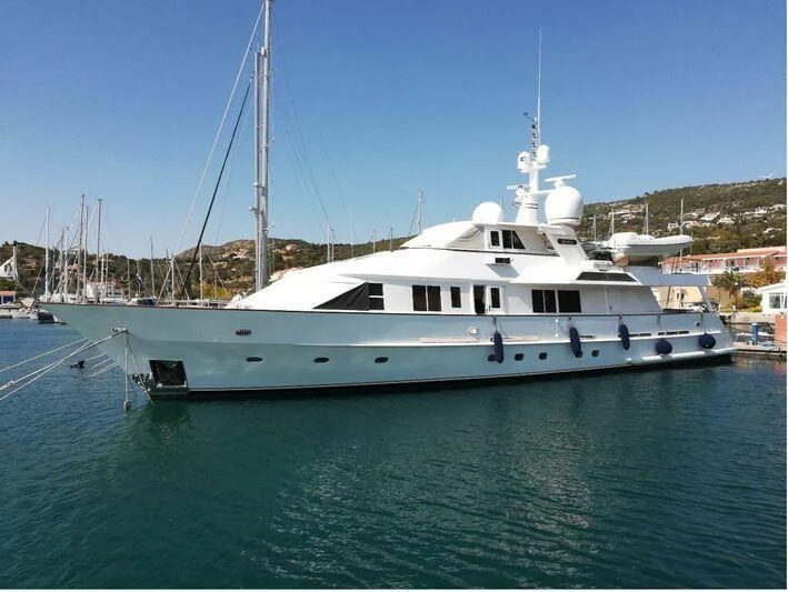 a white boat in the water aboard RAS Yacht for Sale