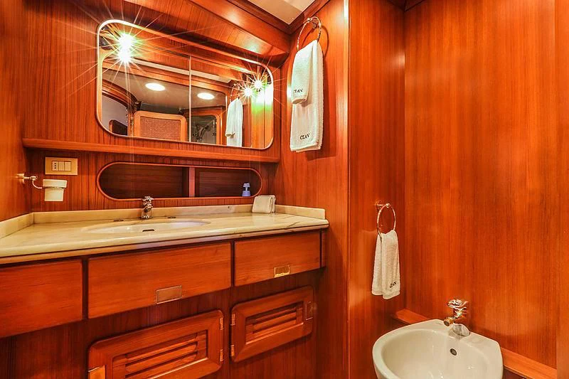 a bathroom with a large mirror aboard INFINIUM Yacht for Sale