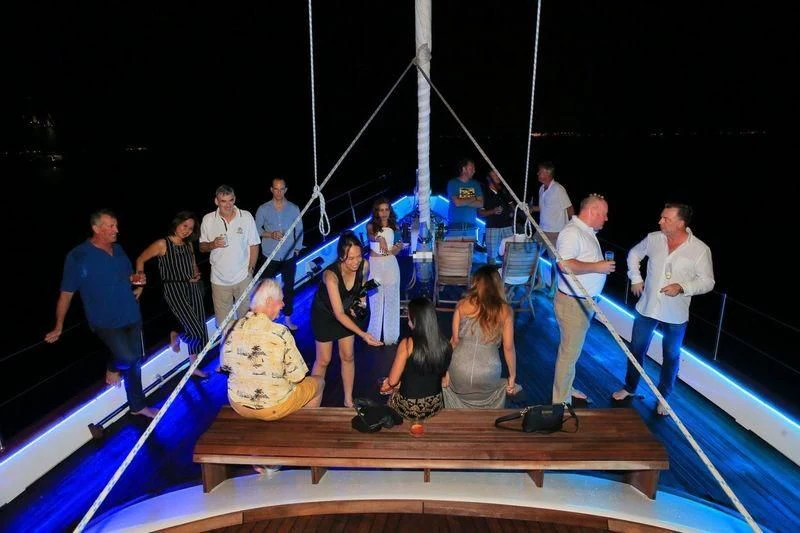 a group of people on a boat aboard INFINIUM Yacht for Sale
