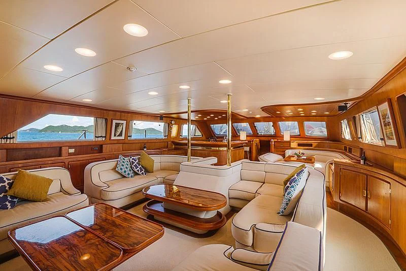 a living room with a couch and a table aboard INFINIUM Yacht for Sale
