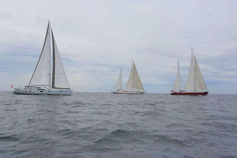several sailboats in the water aboard INFINIUM Yacht for Sale