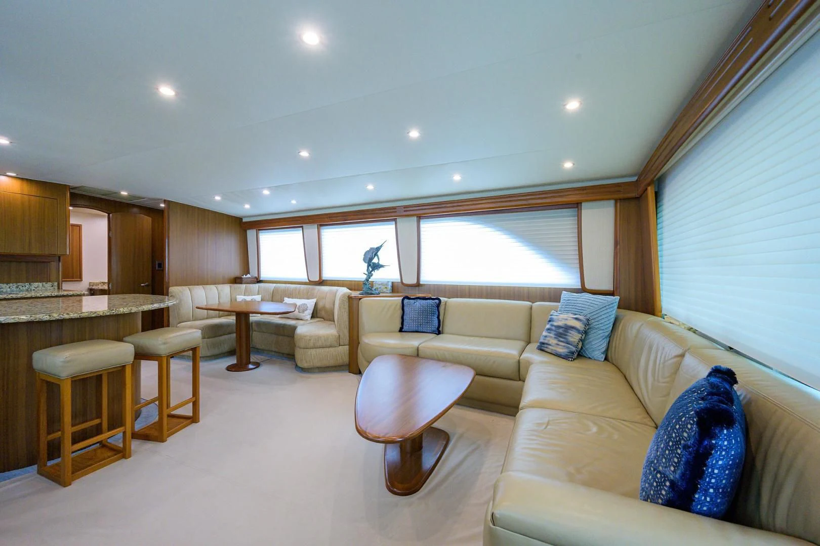a living room with a couch and a table aboard RITE ANGLER Yacht for Sale