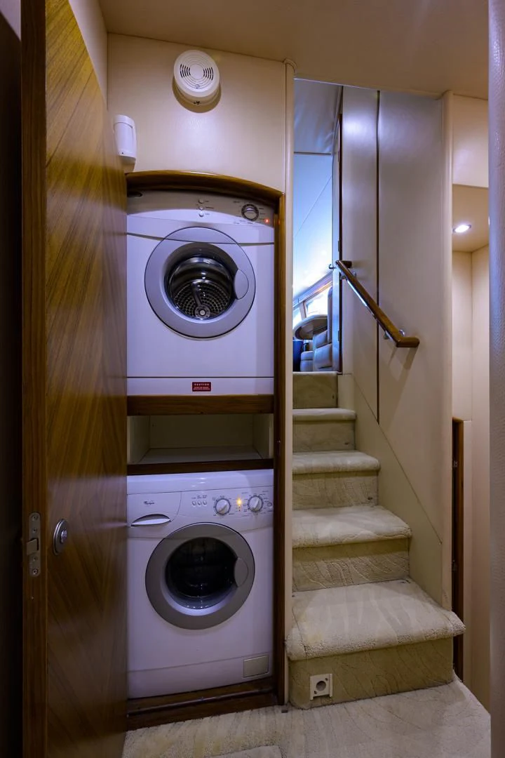 a washer and dryer in a room aboard RITE ANGLER Yacht for Sale