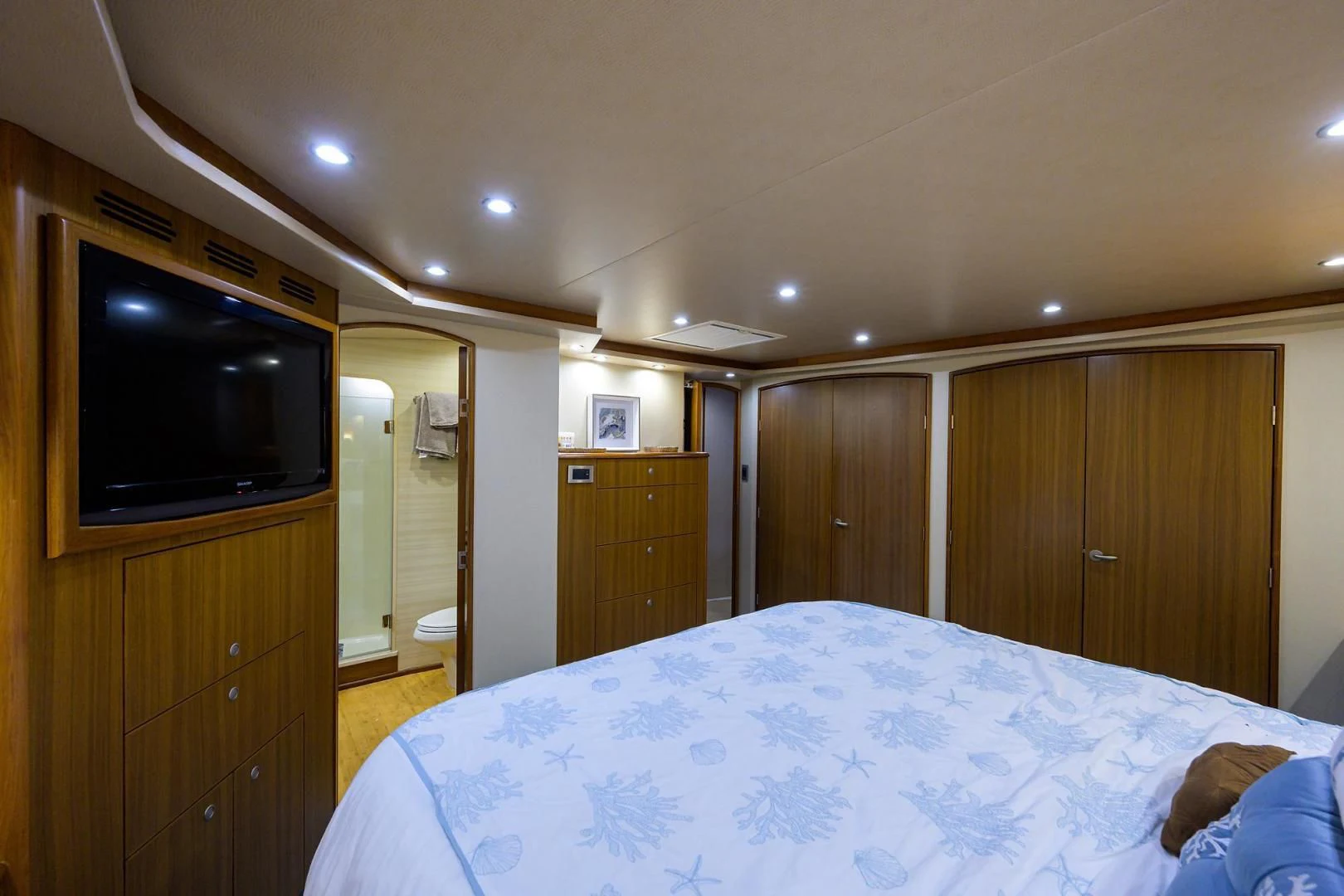 a bedroom with a large tv aboard RITE ANGLER Yacht for Sale