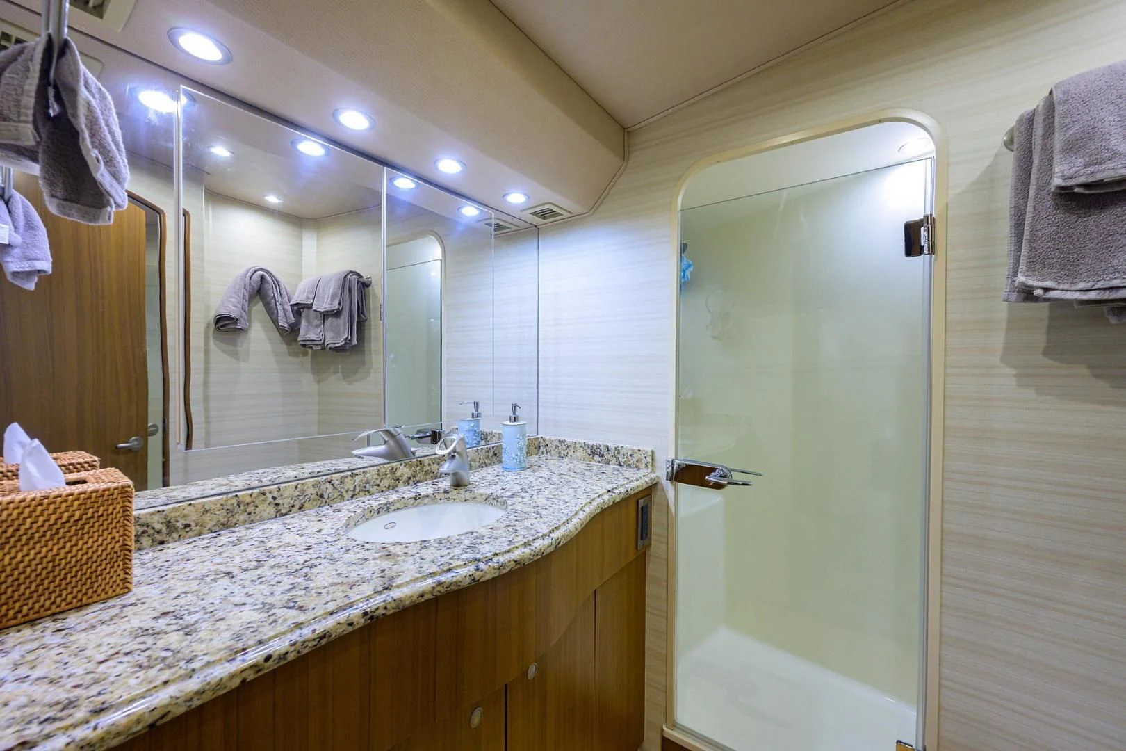 a bathroom with a large mirror aboard RITE ANGLER Yacht for Sale