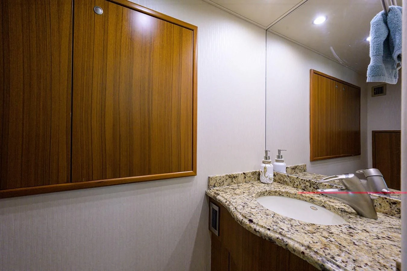 a bathroom with a sink and a mirror aboard RITE ANGLER Yacht for Sale
