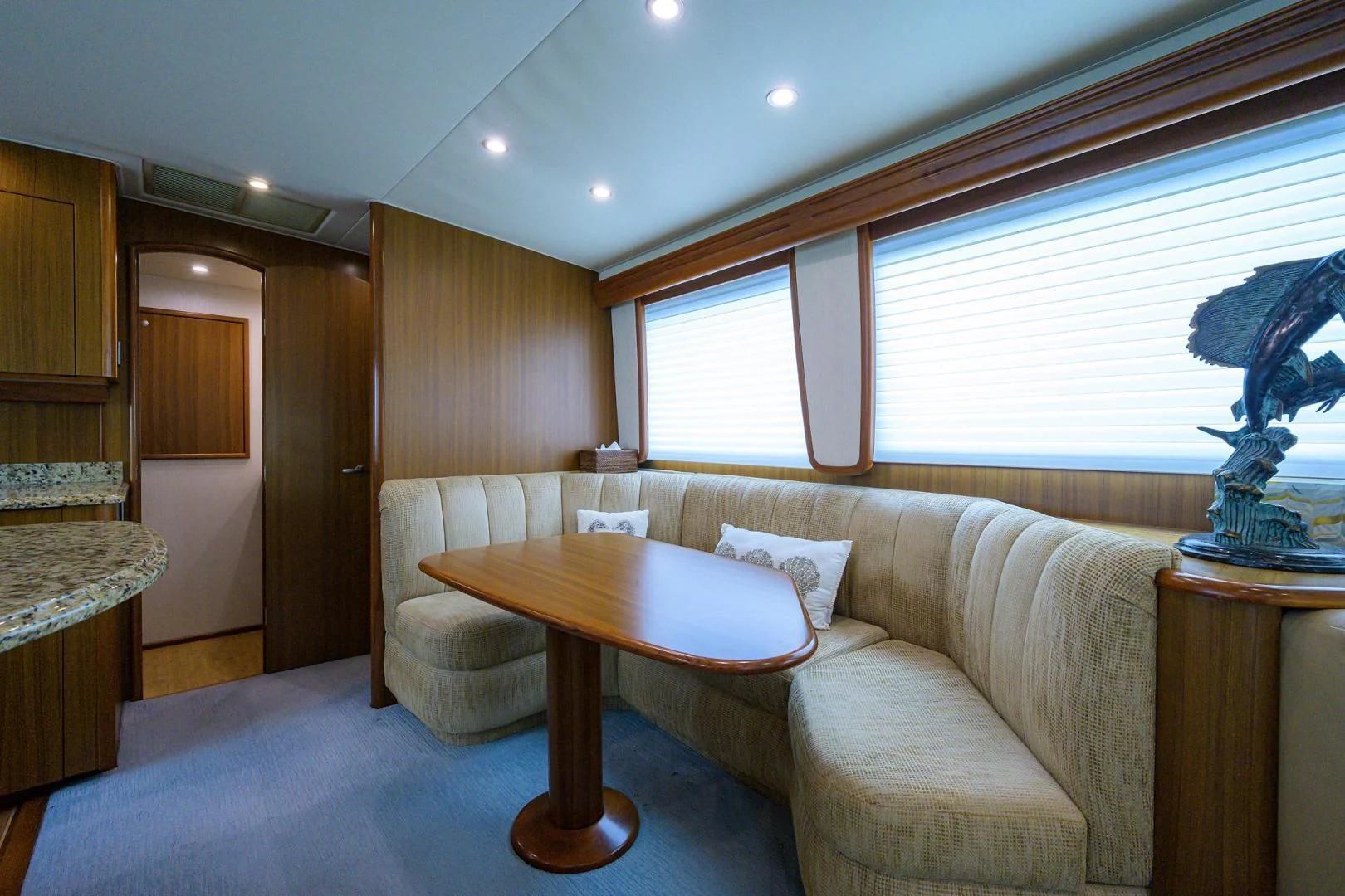 a living room with a couch and a table aboard RITE ANGLER Yacht for Sale