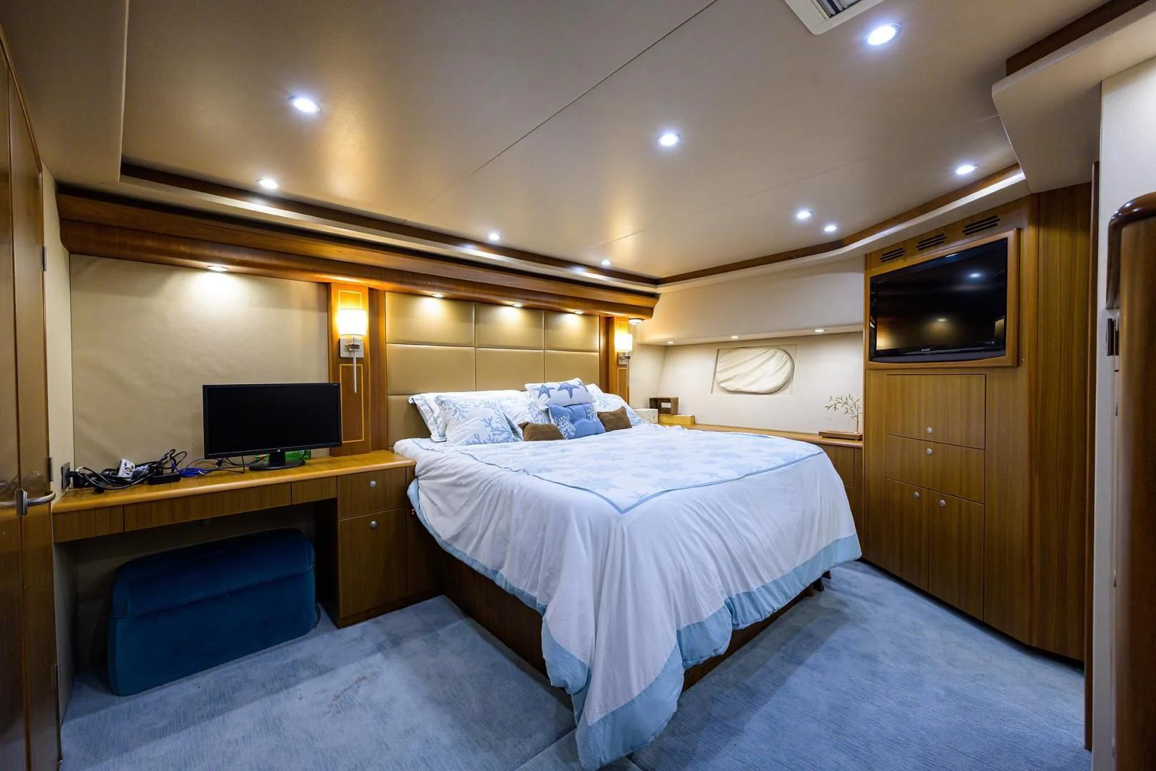 a room with a bed and a television aboard RITE ANGLER Yacht for Sale