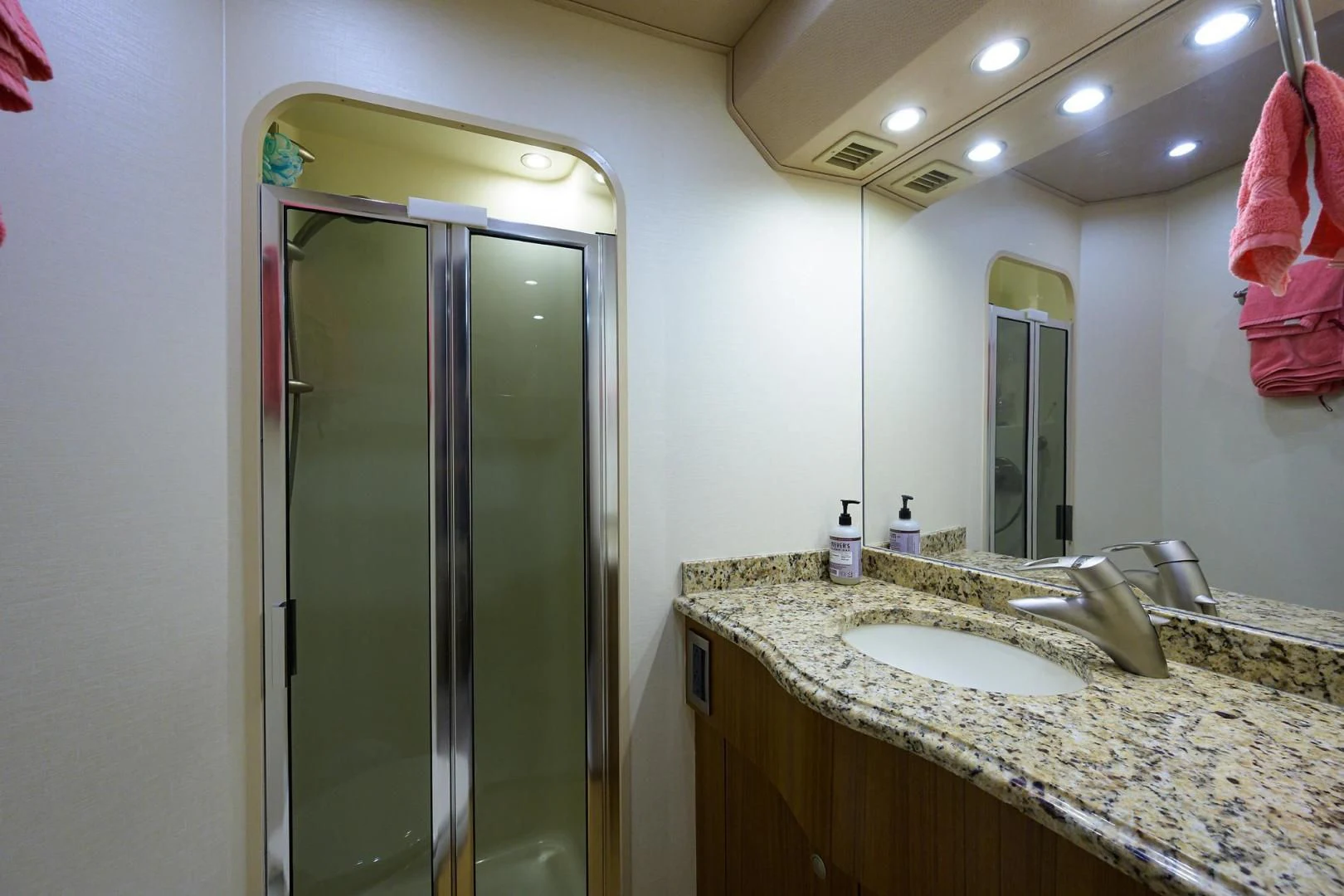 a bathroom with a large mirror aboard RITE ANGLER Yacht for Sale
