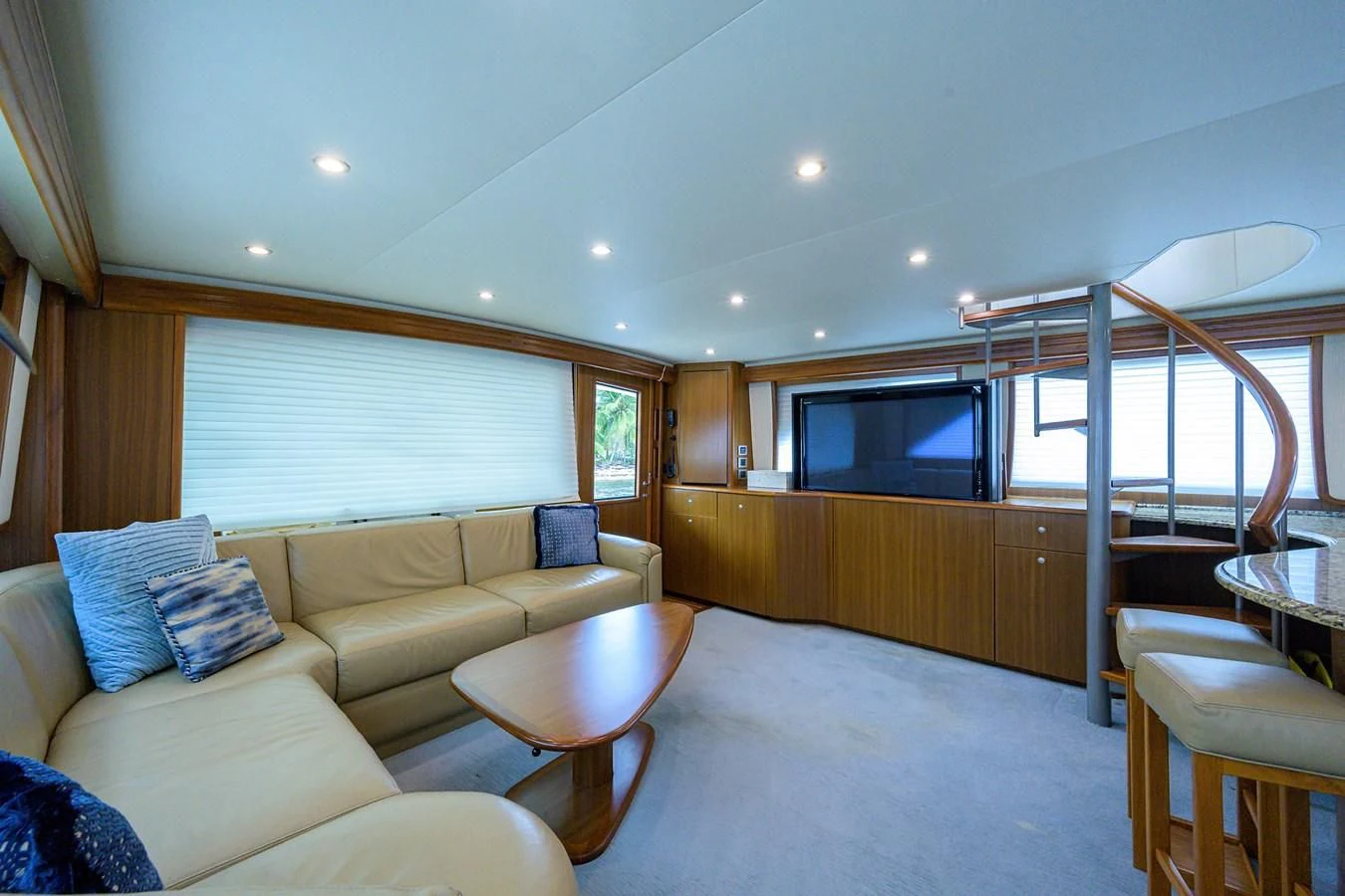 a living room with a couch and a television aboard RITE ANGLER Yacht for Sale