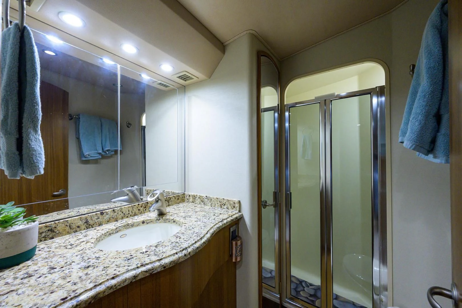 a bathroom with a sink and a shower aboard RITE ANGLER Yacht for Sale