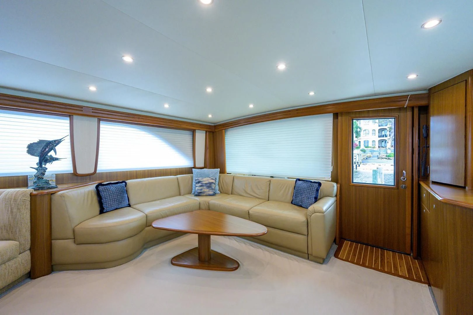 a living room with a couch and a coffee table aboard RITE ANGLER Yacht for Sale