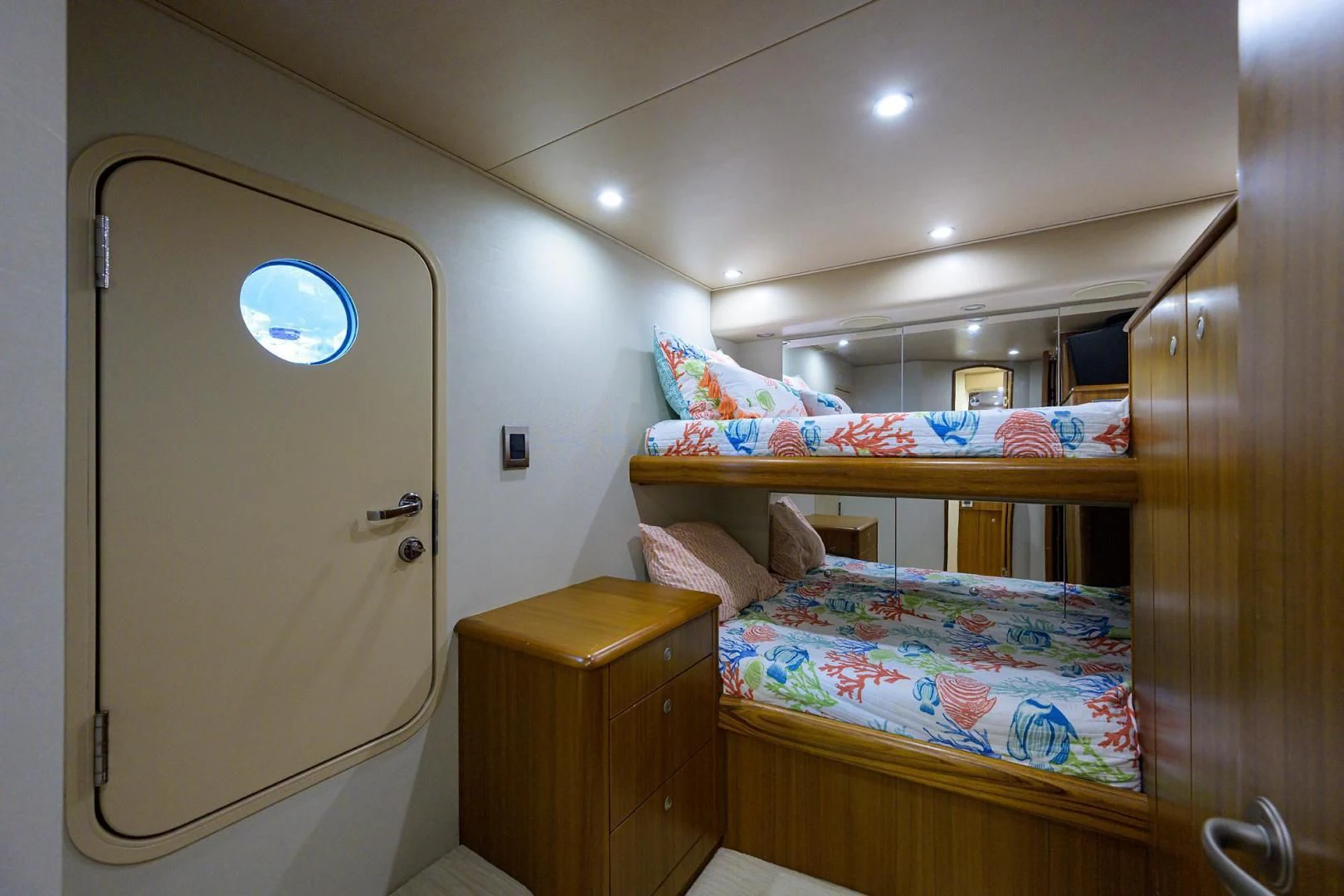 a bedroom with a bed and a closet aboard RITE ANGLER Yacht for Sale