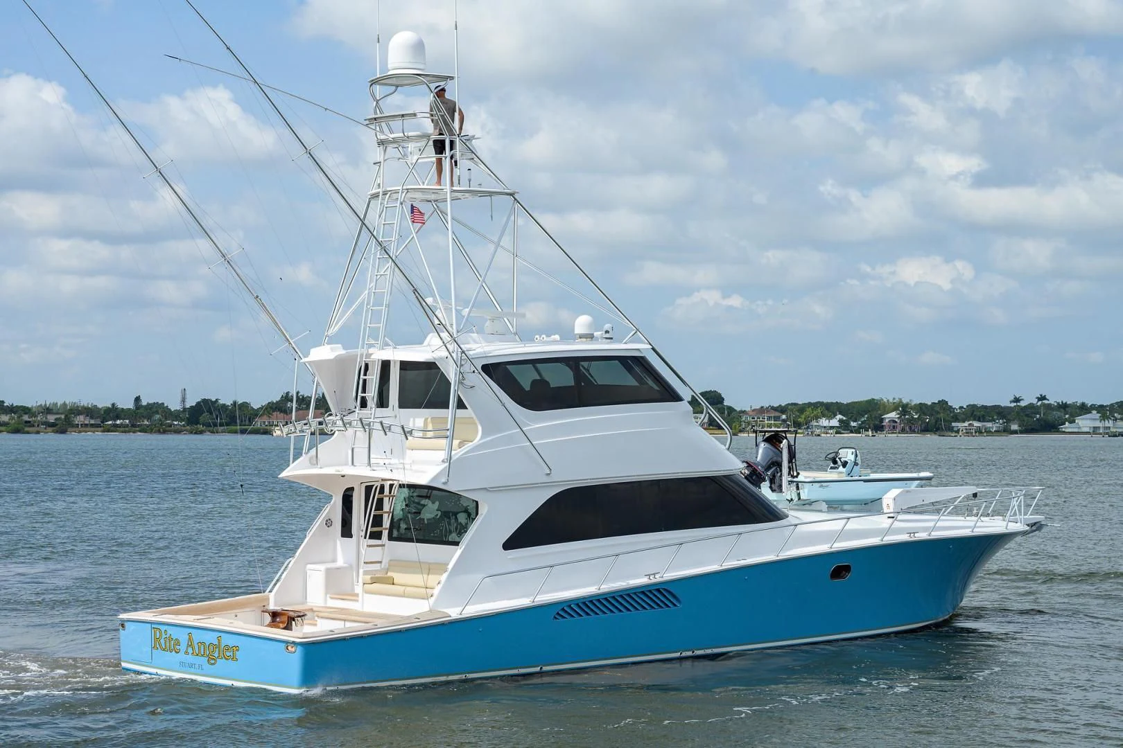 a white yacht on the water aboard RITE ANGLER Yacht for Sale