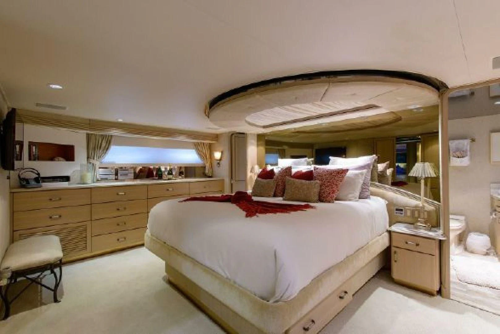 a bedroom with a bed and a desk aboard NO EXCEPTIONS Yacht for Sale