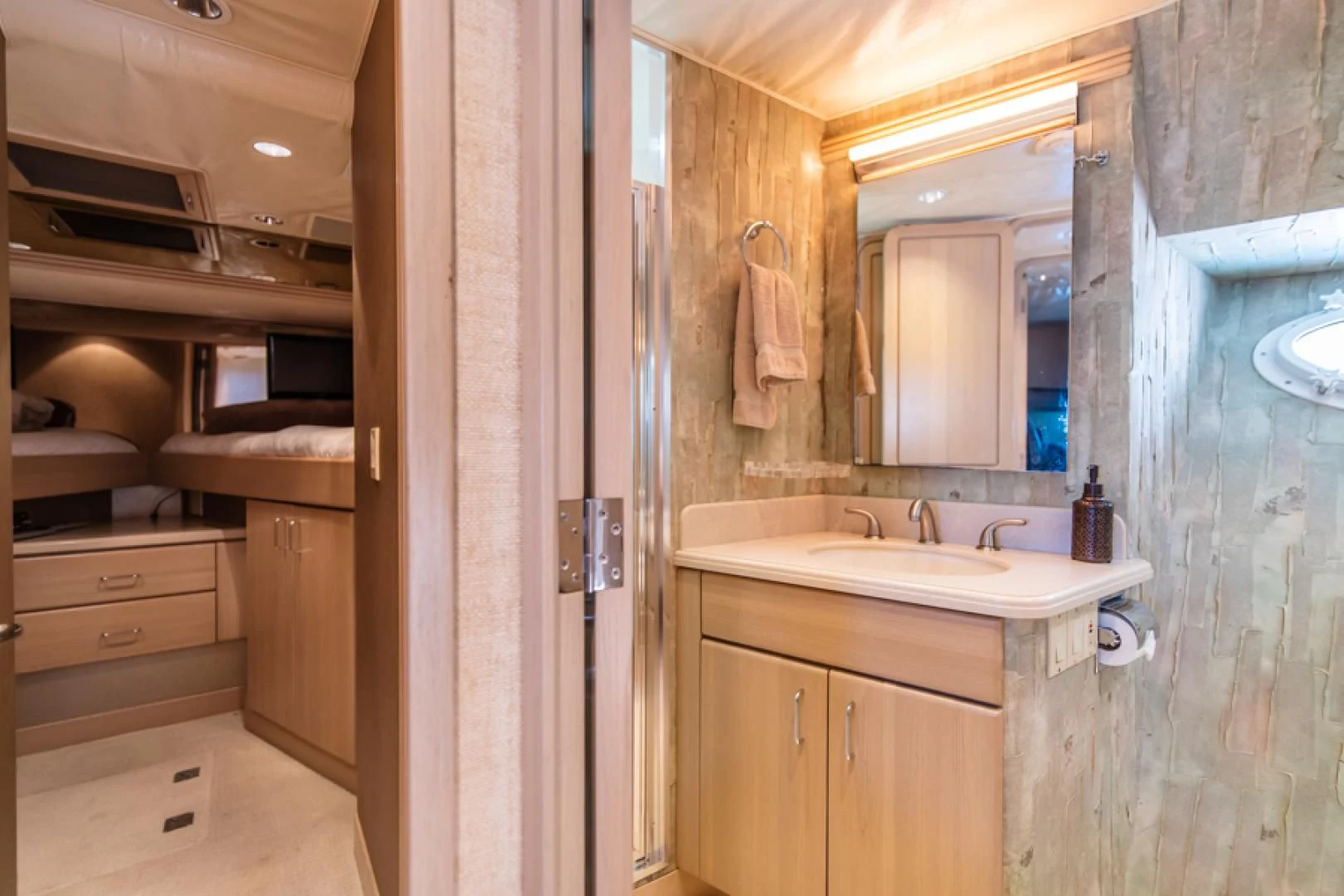 a bathroom with a sink and a mirror aboard NO EXCEPTIONS Yacht for Sale