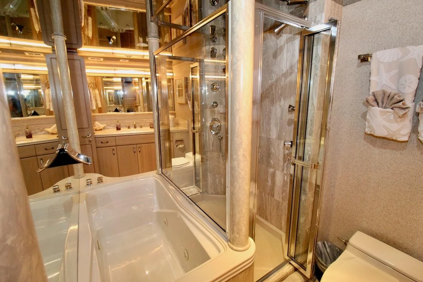a bathroom with a tub and shower aboard NO EXCEPTIONS Yacht for Sale