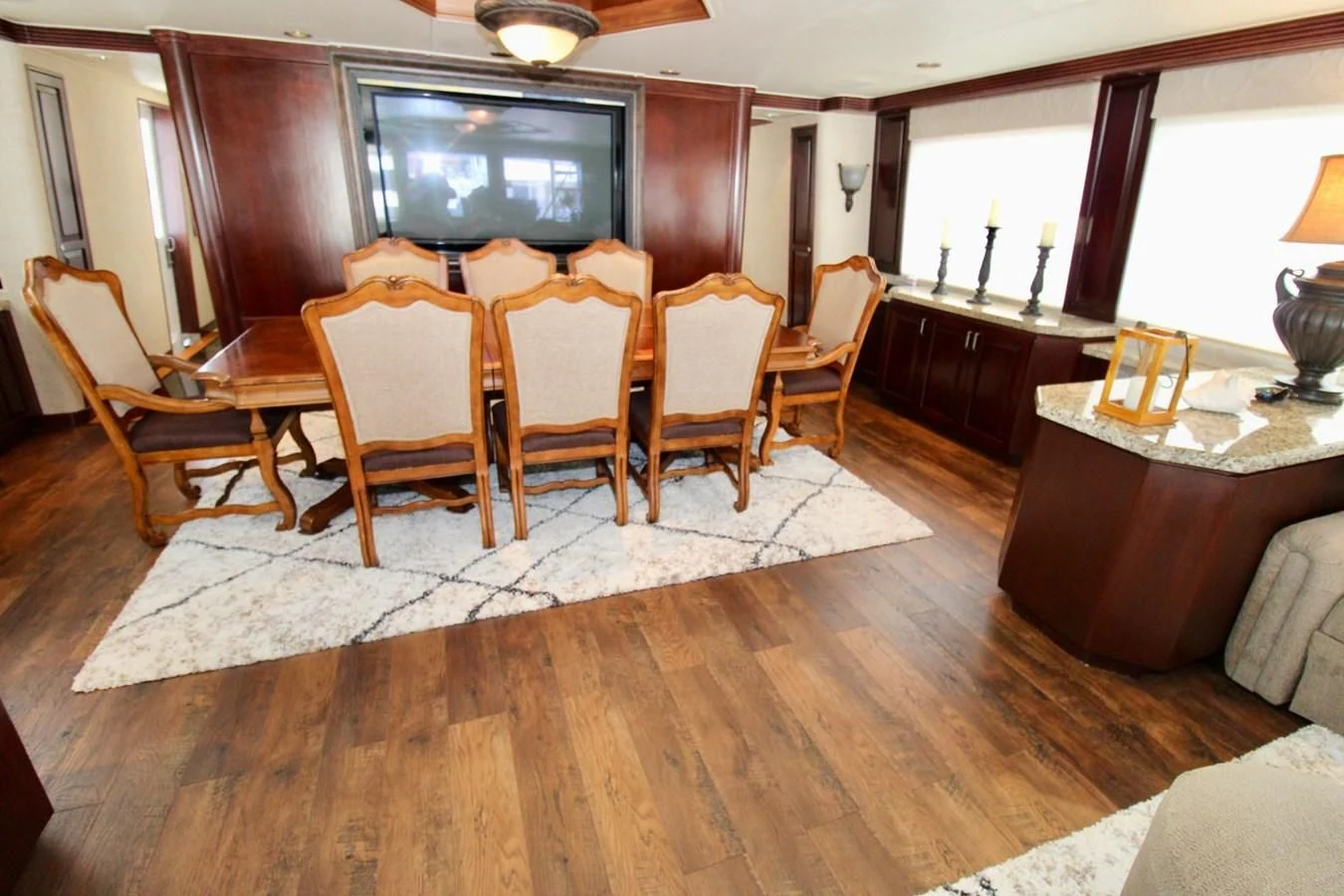 a dining room with a wood table aboard NO EXCEPTIONS Yacht for Sale