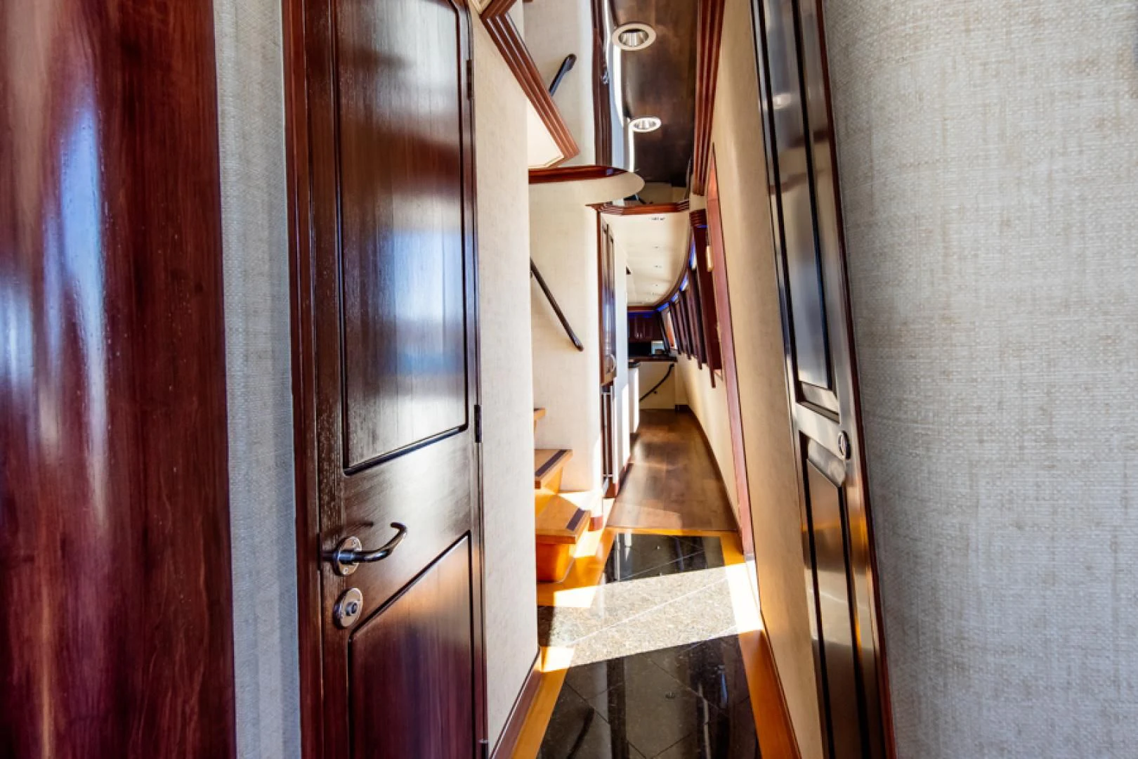 a room with a door and a mirror aboard NO EXCEPTIONS Yacht for Sale