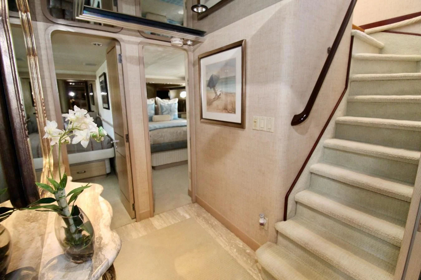 a staircase with a vase of flowers aboard NO EXCEPTIONS Yacht for Sale