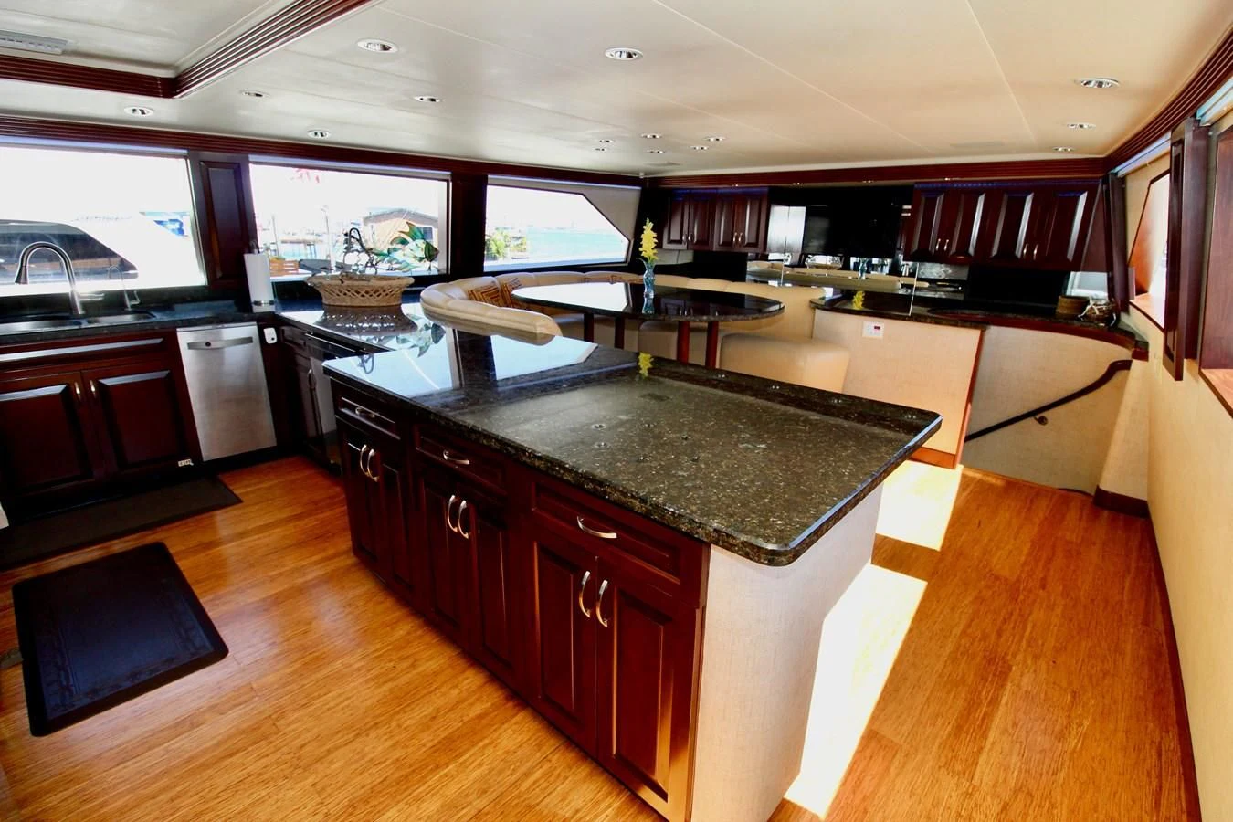 a kitchen with a bar and a large island aboard NO EXCEPTIONS Yacht for Sale