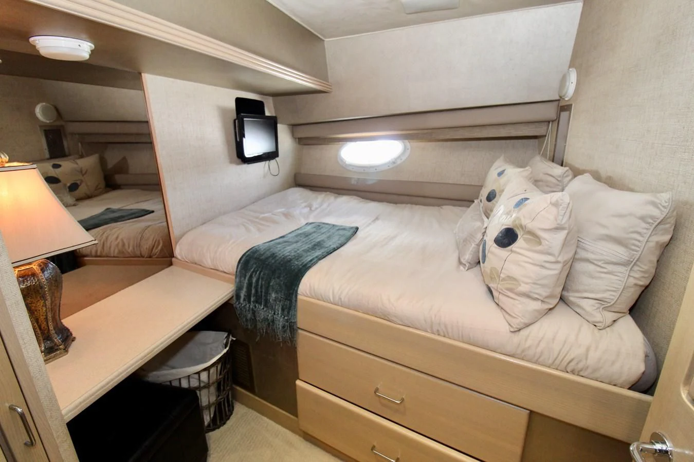 a bed with a white pillow aboard NO EXCEPTIONS Yacht for Sale