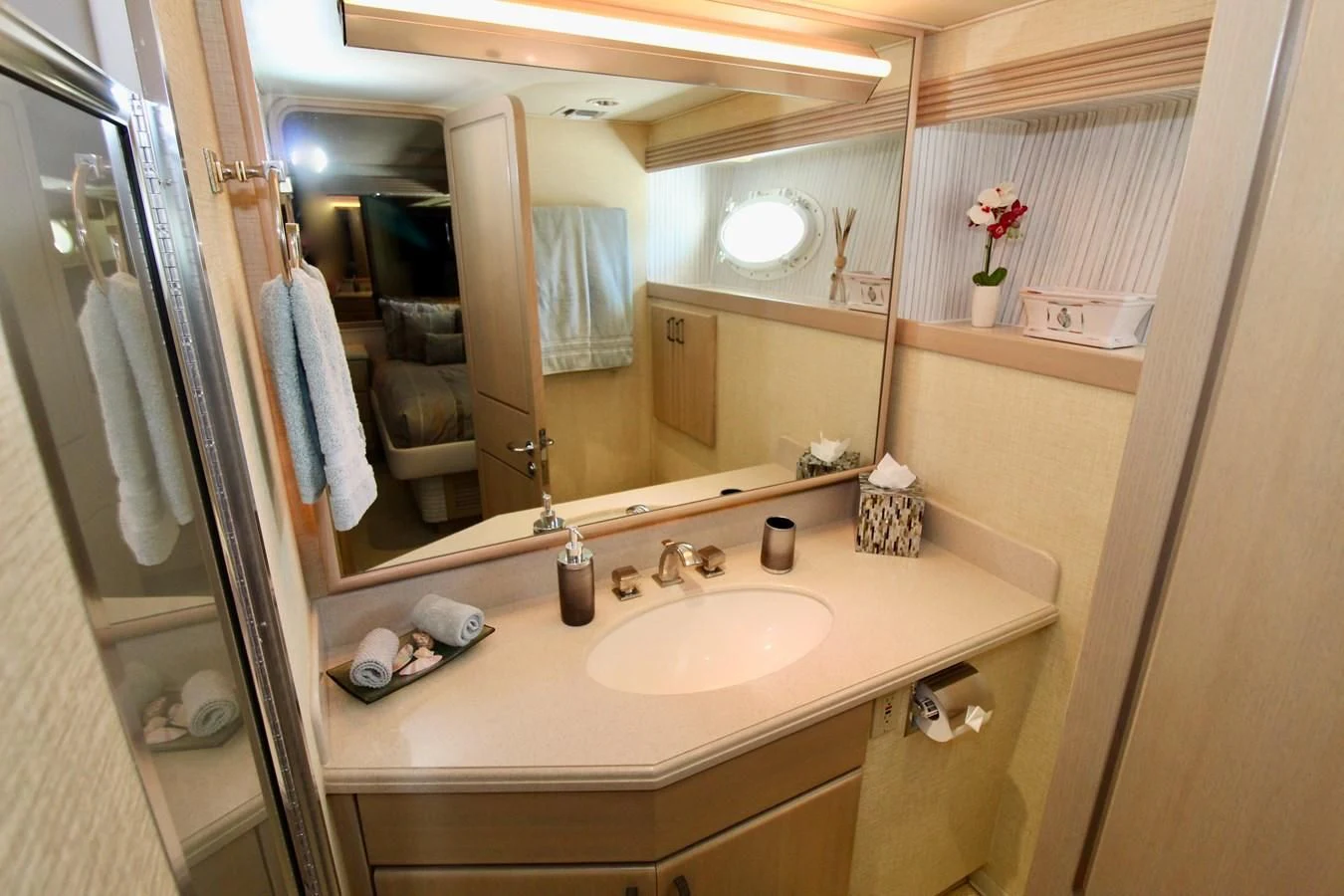 a bathroom with a sink and mirror aboard NO EXCEPTIONS Yacht for Sale