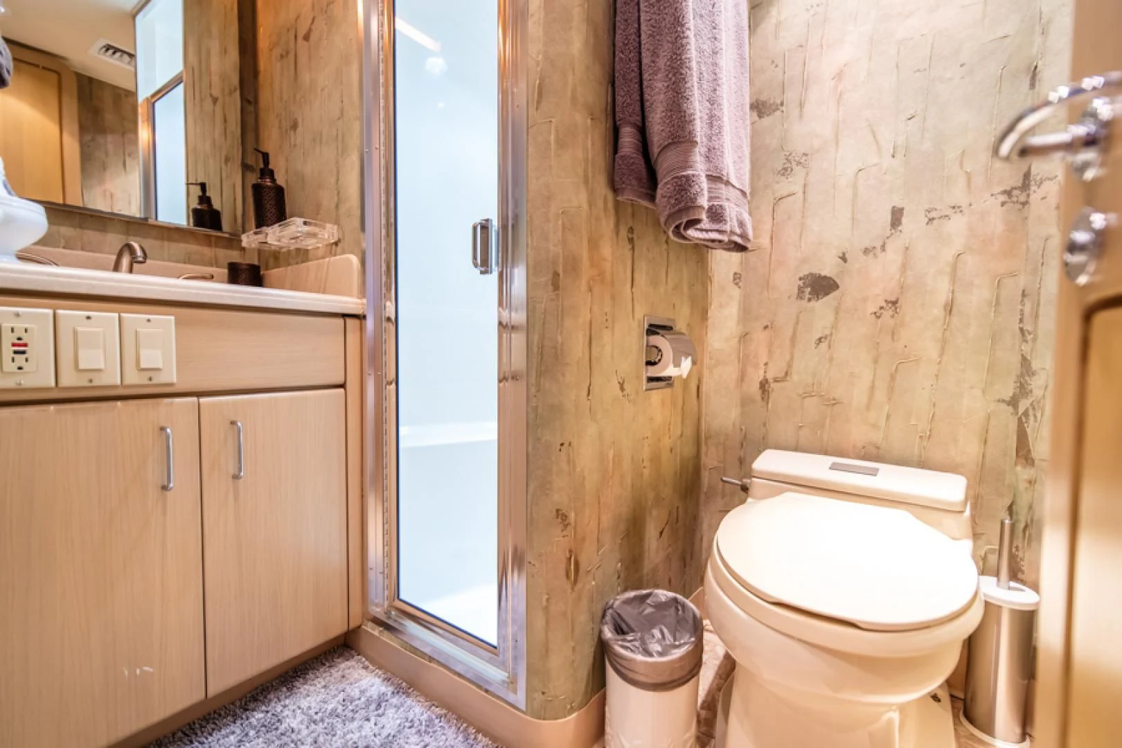 a bathroom with a toilet and a sink aboard NO EXCEPTIONS Yacht for Sale