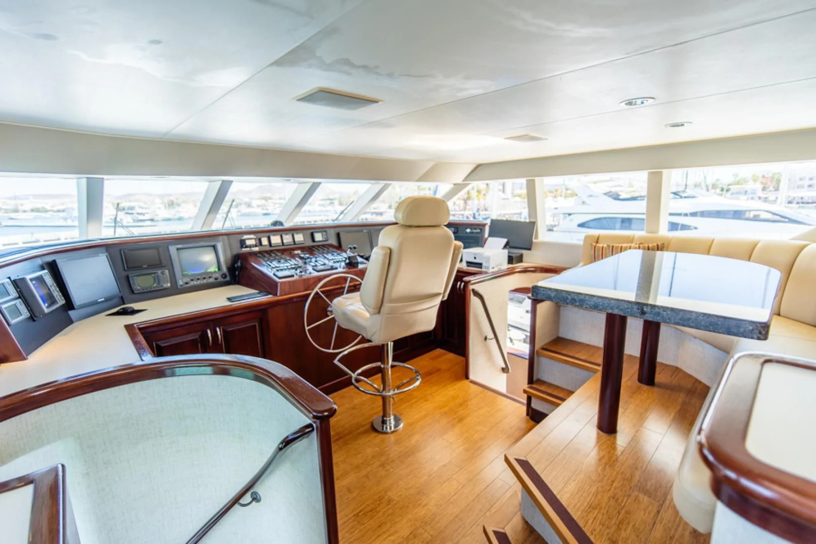 a room with tables and chairs aboard NO EXCEPTIONS Yacht for Sale