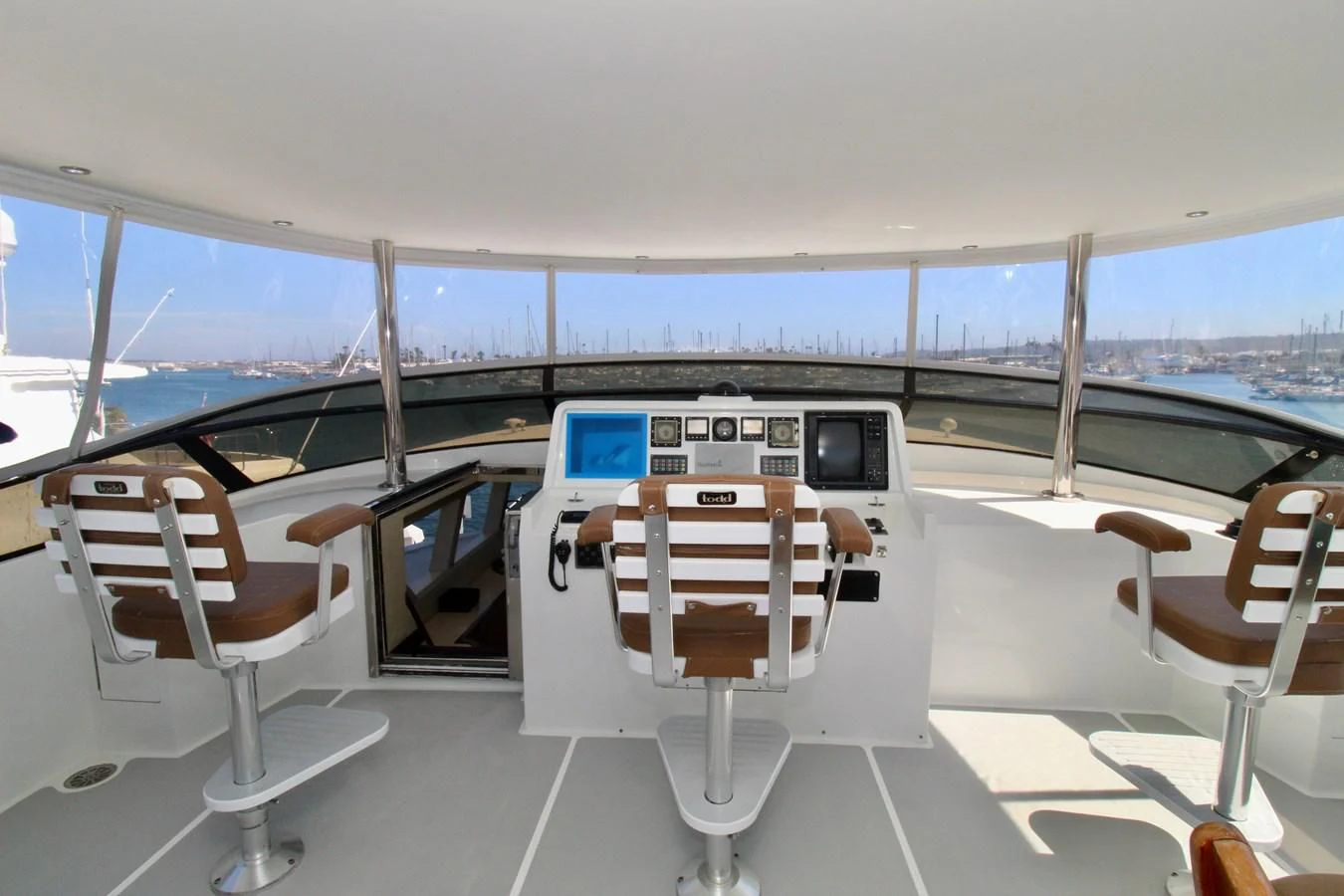 a boat with chairs and a table aboard NO EXCEPTIONS Yacht for Sale