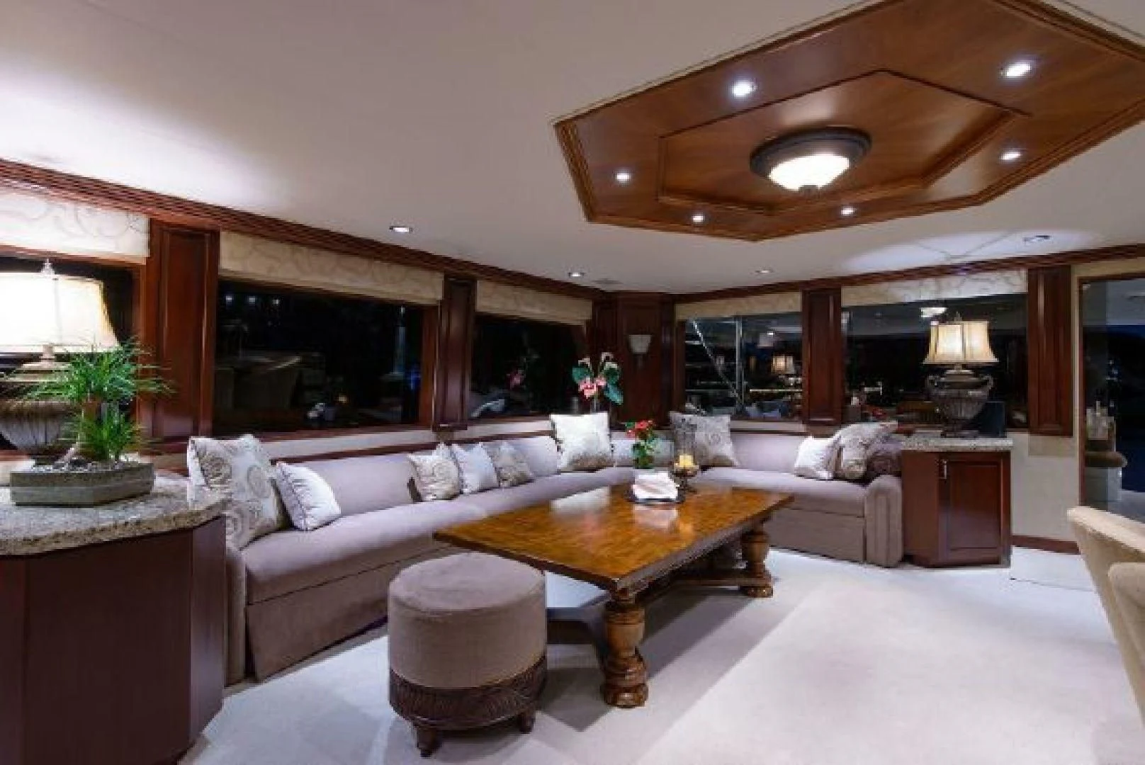a living room with a large sofa aboard NO EXCEPTIONS Yacht for Sale
