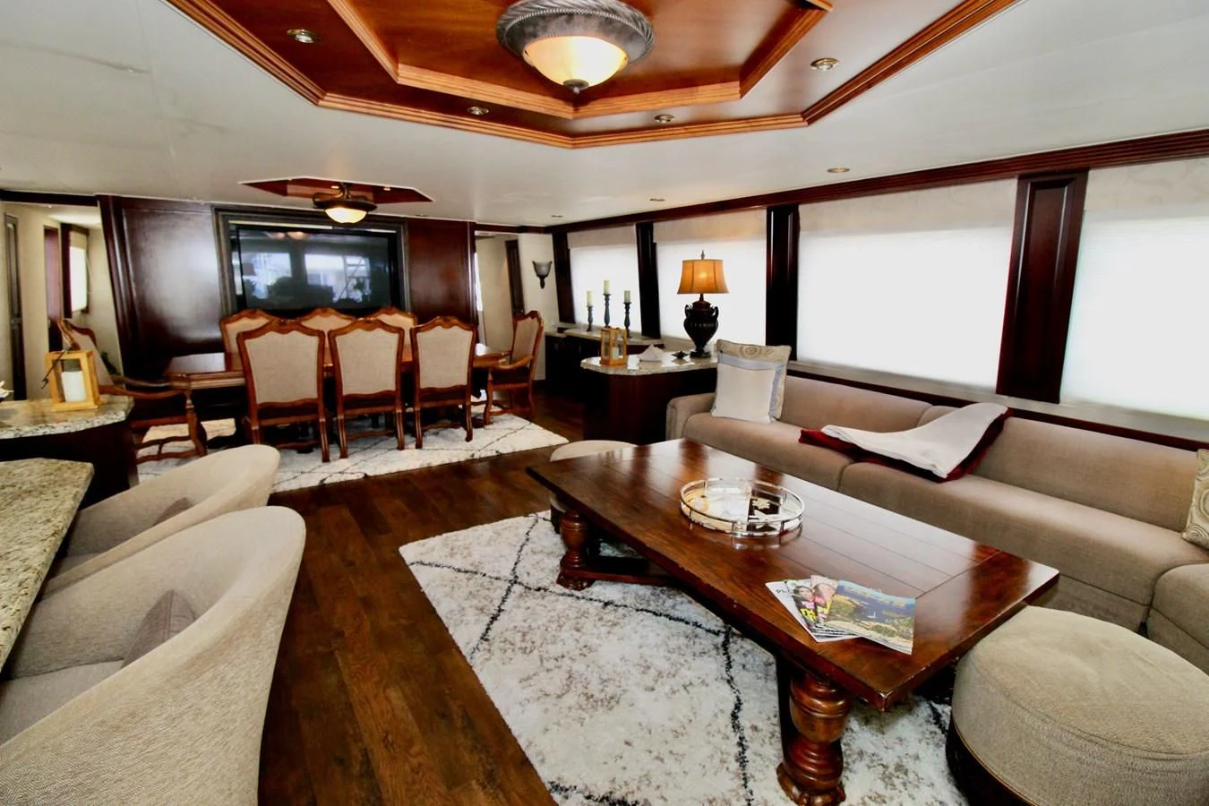 a living room with a large window aboard NO EXCEPTIONS Yacht for Sale