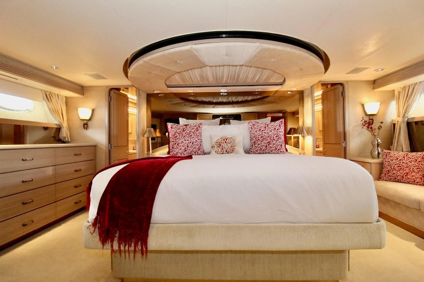 a large bed with pink pillows aboard NO EXCEPTIONS Yacht for Sale